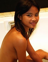 Sweet and sexy Asian teen has a good time in the bathtub